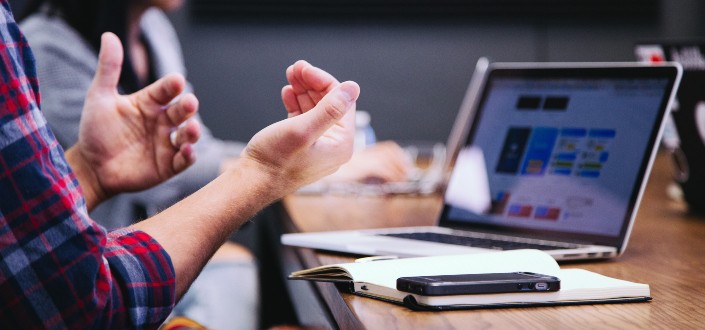 unidentified person making hand gestures