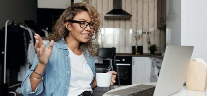 Woman using laptop doing a video call