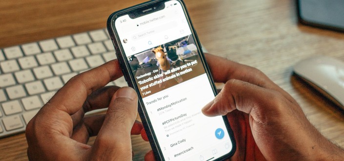Person Browsing Through His Phone