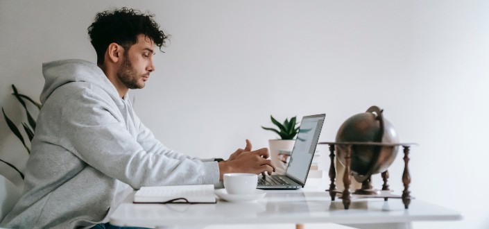 Remote Employee Working on Laptop at Home