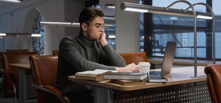 Man Studying Alone at a Coffee Shop