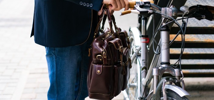 Man Wearing formal attire Beside the Parked Bicycle