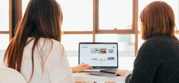Two Women Using a Laptop