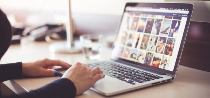 Woman Browsing Photos on Her Laptop