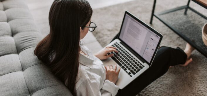 Woman Typing on Her Laptop