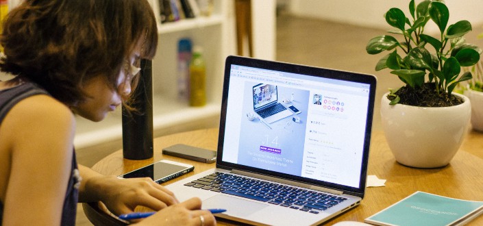 woman browsing on her laptop