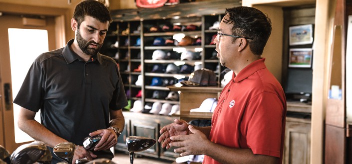 Man Selling Putter to a Customer - What is Cross Selling
