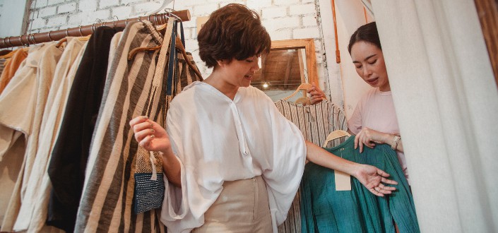 women choosing clothes in modern atelier
