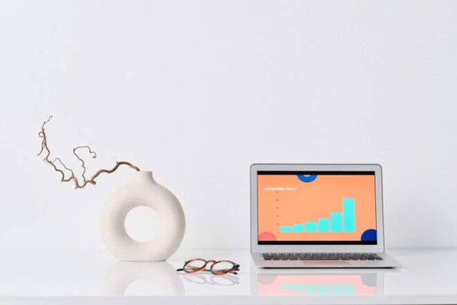 Laptop Beside a Ceramic Vase - What Is a Breadcrumb Navigation?