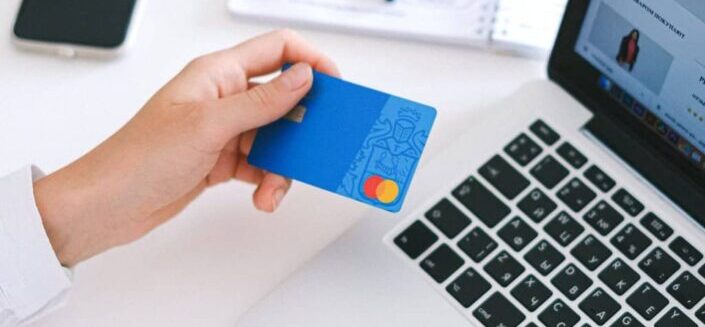 Person Holding Bank Card