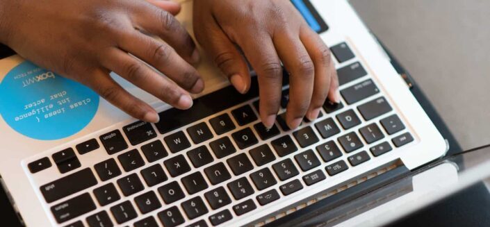 Person Using Silver Laptop Computer