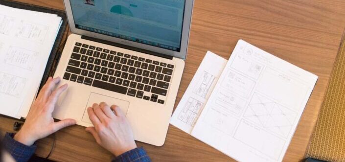 Person's Hands on Top of Macbook Air
