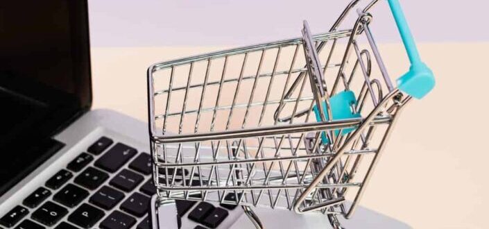 Miniature Shopping Cart on a Laptop