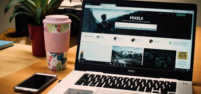 Gray Dell Laptop Displaying Pexels Webpage