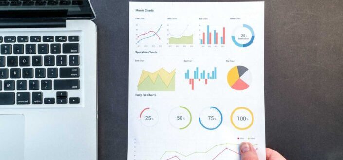 Person Holding Chart And Bar Graph