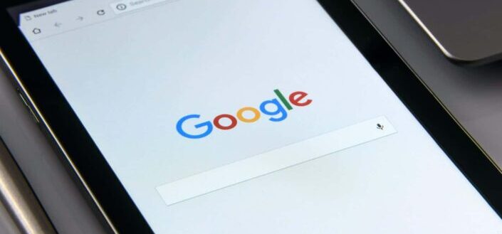 A black tablet lying on a table
