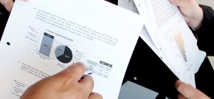 Person Holding Document Papers