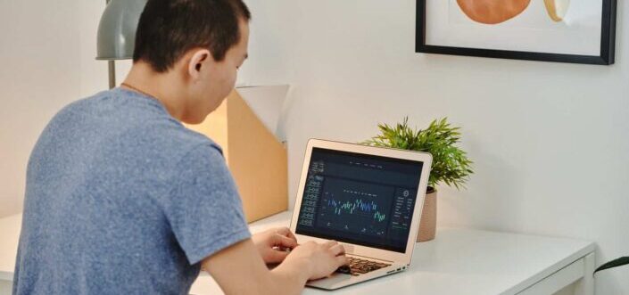 A Man Using His Laptop