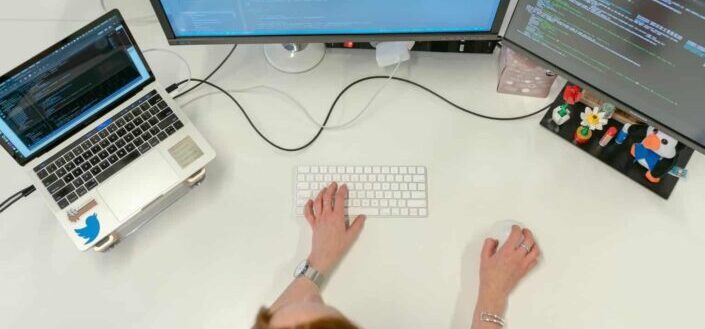 Female Software Engineer Coding on Computer