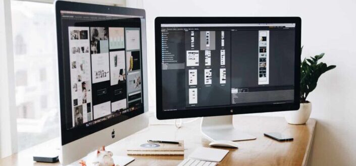 Two Imac's With Keyboard on Desk